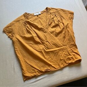 KRISTINIT mustard yellow Swiss Dot short sleeve boxy surplice front blouse top